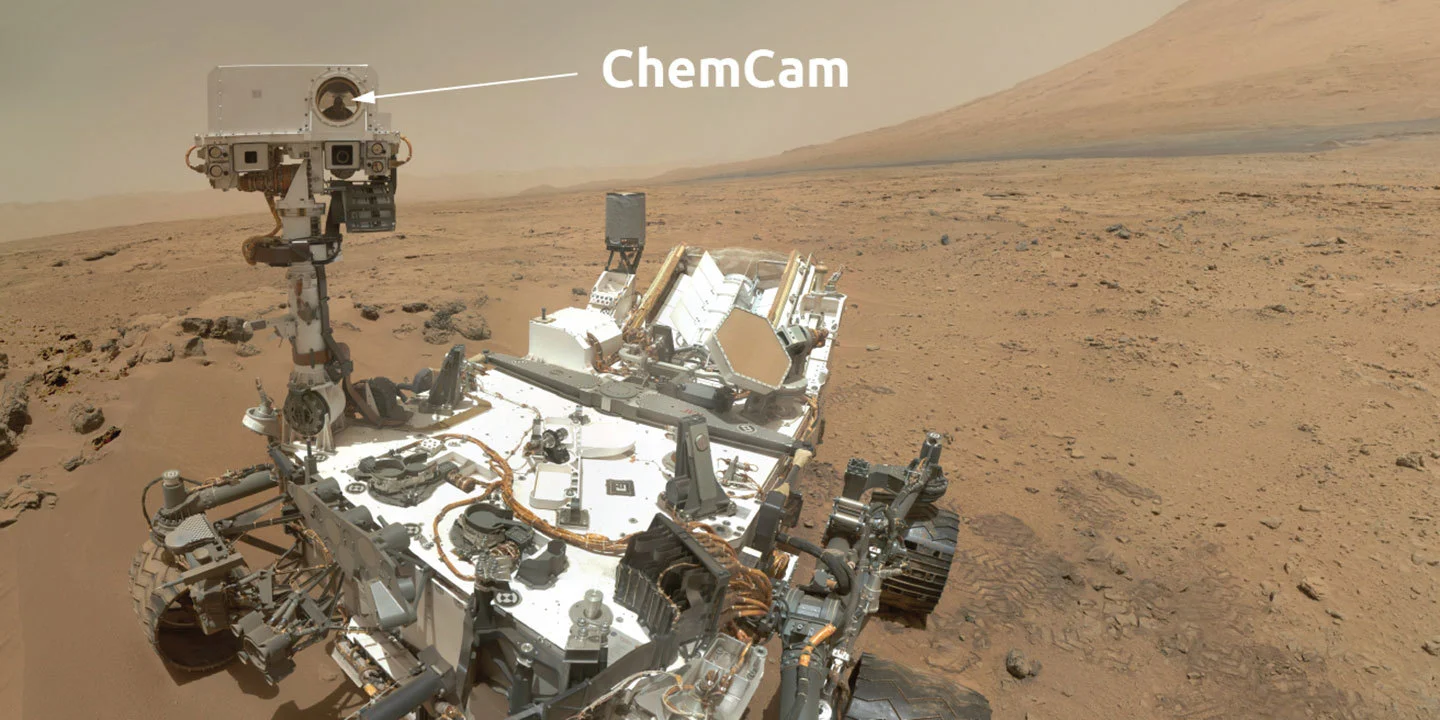 ChemCam instrument on NASA's Curiosity rover analyzing a Martian rock target with its laser